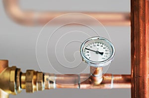 Heating system`s cooper pipes with Thermometer