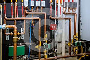 Heating system& x27;s copper pipes with ball valves on pipes collector of underfloor heating system