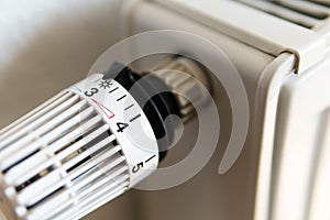 Heating thermostat valve set to number 3 icon, symbol for saving money at heating costs or medium temperature setting