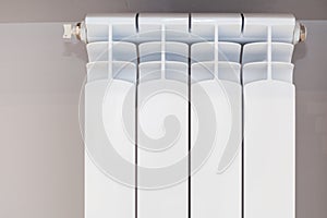 Heating white radiator with adjuster of warming in living room