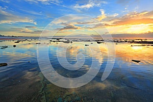 Heaven and Earth reflecting. Morning sky reflected in the ocean