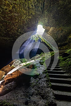 Between heaven and hell concept. The stair cave near Lovech, Bulgaria