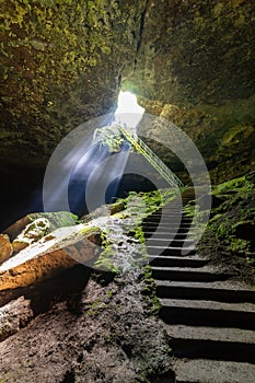 Between heaven and hell concept. The stair cave near Lovech, Bulgaria