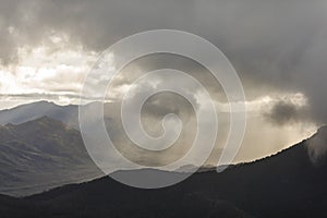 Heavenly light over dramatic mountains in Tasmania, Australia