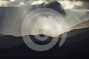 Heavenly light over dramatic mountains in Tasmania, Australia