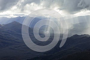 Heavenly light over dramatic mountains in Tasmania, Australia