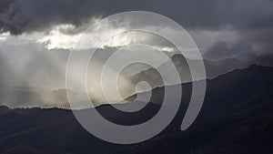 Heavenly light over dramatic mountains in Tasmania, Australia