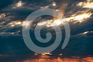 The heavenly light of the sun.Dramatic evening sky with clouds and rays of the sun.Sunlight at evening sunset or morning dawn.