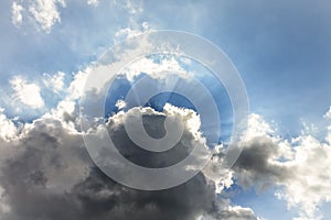 Sun Rays Burst from Behind a Cloud