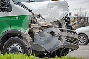 Heavily damaged car after car crash accident on a city street