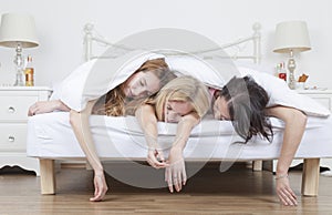 Heavily drunk women sleep in bed