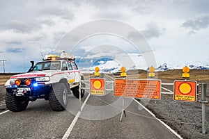 Heavily modified search and rescue Toyota Landcruiser 4x4 truck closing the road