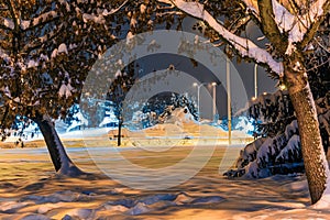 Heavily snow-covered road and sidewalk in an industrial town in Silesia, Poland, JastrzÄ™bie-Zdroj at night