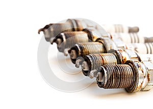 Heavily worn spark plugs isolated on white