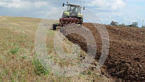 Heavy agriculture machine tractor plow field