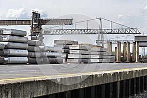 Heavy aluminum bars stacked on top of each other in an aluminum smelting plant, located in the square.