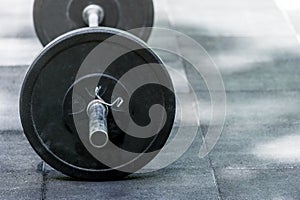 Heavy barbell on the floor of a gym studio copyspace bodybuilding weightlifting fitness power strength endurance agility workout e