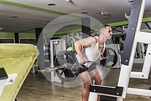 Heavy barbell lifting in the gym