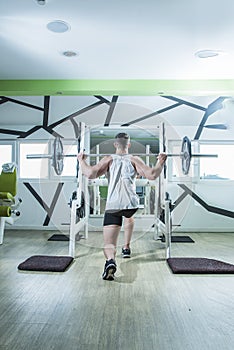 Heavy barbell lifting in the gym