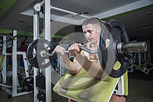 Heavy barbell lifting in the gym