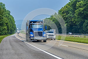 Heavy Blue Dump Truck On Interstate Highway With Copy Space