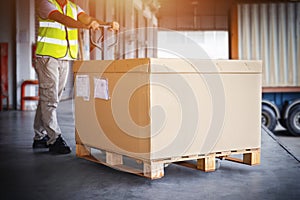 Heavy Boxes Pallet. Workers Unloading Package Boxes in Warehouse. Shipping Supplies Warehouse. Goods. Supply Chain. Distribution