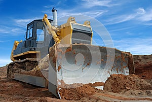 Heavy bulldozer standing in sandpit