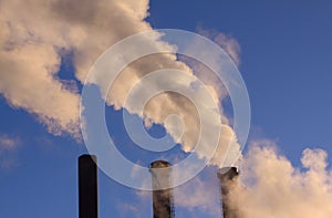 Heavy cloud of smoke from industrial chimneys with copy space