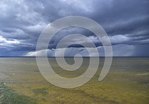 Heavy clouds and green water