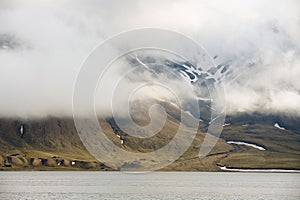 Heavy clouds over the arctic shore of the polar archipelago of Spitsbergen near Longyearbyen, Norway.