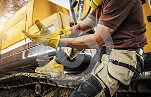 Heavy Construction Equipment Operator Wearing Safety Gloves