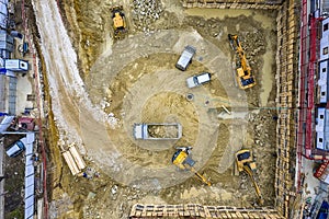 Heavy construction equipment working at the construction site.