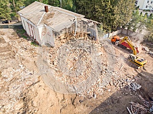 Heavy construction machines clearing out construction site