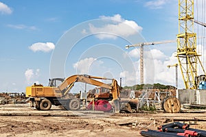 A heavy crawler excavator with a large bucket is getting ready for work. Heavy construction equipment for earthworks. Quarry