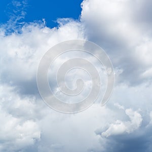Heavy cumuli clouds in blue sky photo
