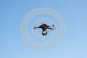 Heavy drone with cinema camera flying photo
