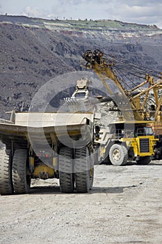 Heavy dump trucks at the loading queue