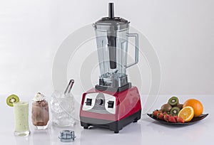 Heavy duty blender with glasses of smoothie