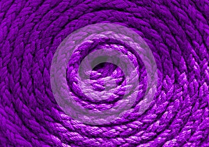 Heavy-duty bright purple coiled ships rope looking from above. Round shapes for concept copy space