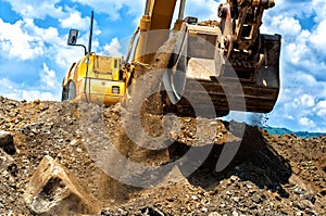 Heavy duty construction excavator moving earth