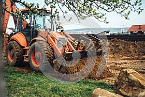 heavy duty earth moving bulldozer doing landscaping and moving soil