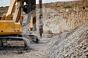 heavy duty machinery on construction site. Detail of highway building with rotary drilling machine