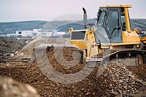 heavy duty machinery, details of excavator pushing earth and building highway. construction site