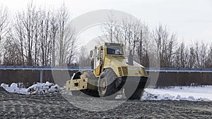 Heavy duty machinery working on highway construction site.