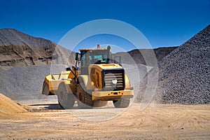 Heavy duty machinery working on highway construction site. Bulldozer, dumper truck, tractor.