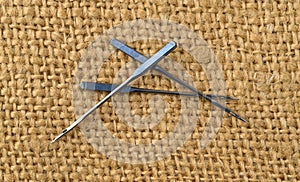 Heavy duty sewing machine needles on burlap