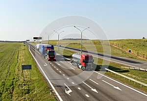 Heavy duty tractor unit with push-pull transportation of heavy and oversized cargo by road. Oversize Load Logistics. Oversized and