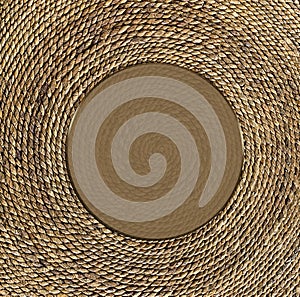 Heavy-Duty Twine/Cording wrapped tightly together to form Circle Image. Brown Text area in the center.