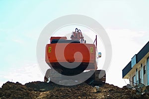 Heavy earth mover, excavator loader machine during earthmoving w