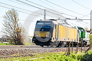 Heavy electric locomotive lling a cargo train